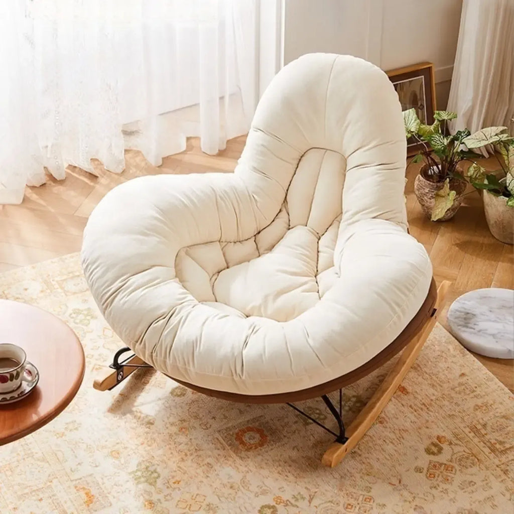 Fauteuil à bascule rembourré beige à assise large avec repose-pieds