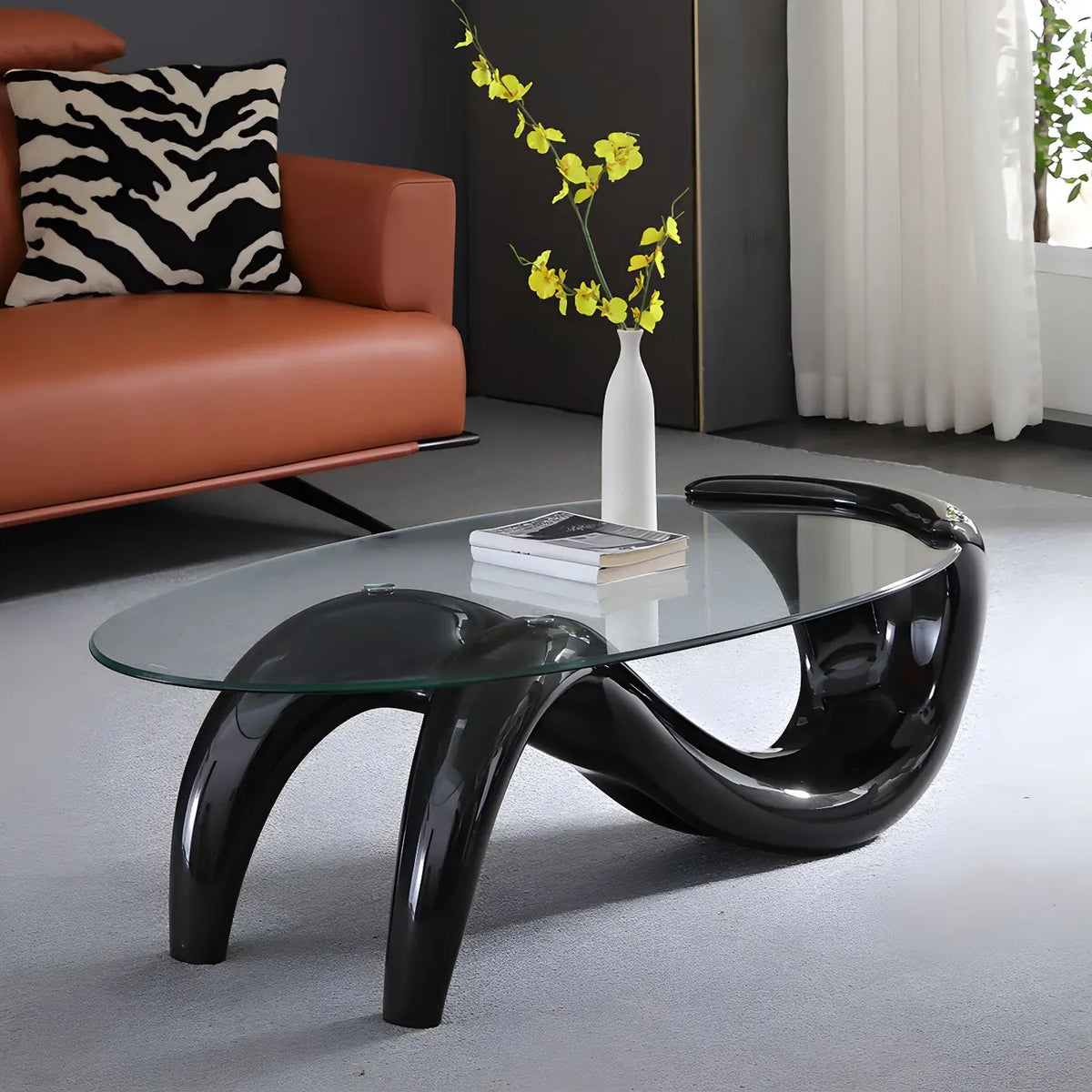 Table basse ovale moderne abstraite avec plateau en verre et piètement en métal