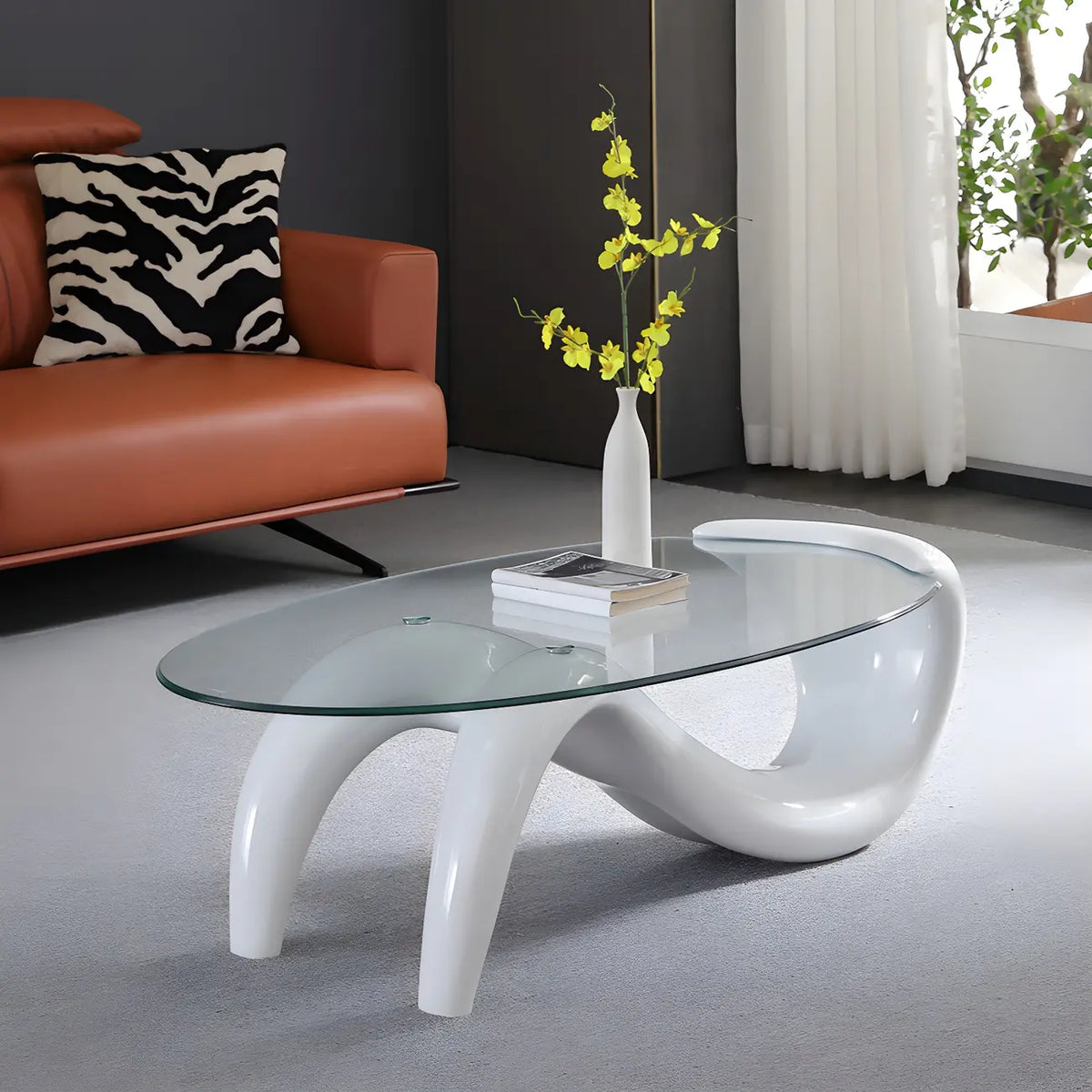 Table basse ovale moderne abstraite avec plateau en verre et piètement en métal