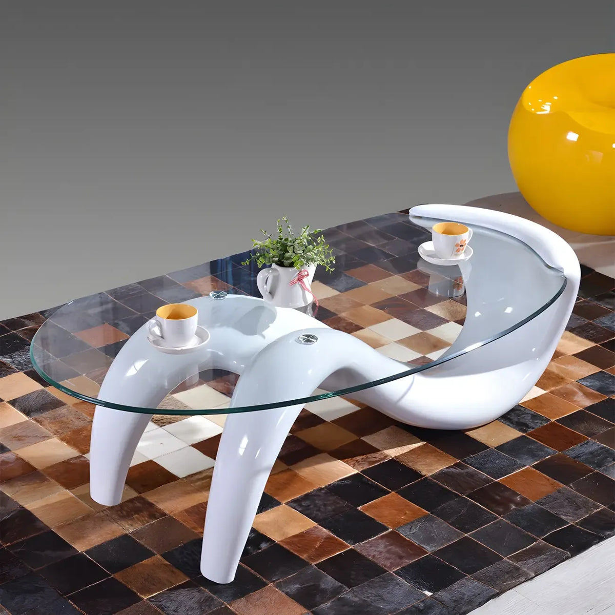 Table basse ovale moderne abstraite avec plateau en verre et piètement en métal